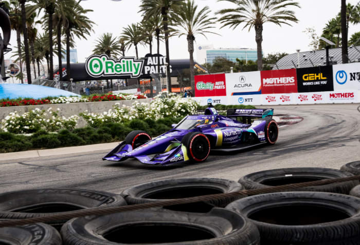Grosjean speeding through the IndyCar course in his Dale Coyne car.